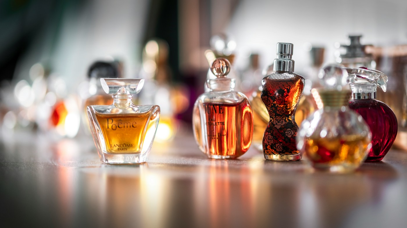 Luxury fragrance bottles in a cinematic editorial setting