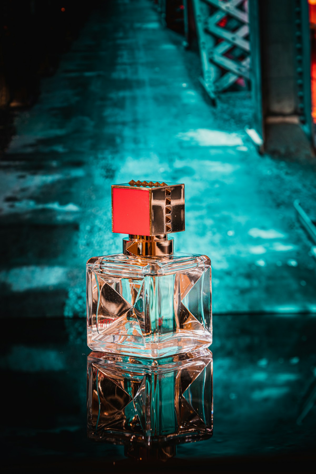 Clear glass perfume bottle in a luxury setting